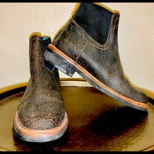 These boots are new and have been worn only once. The look is intentional.